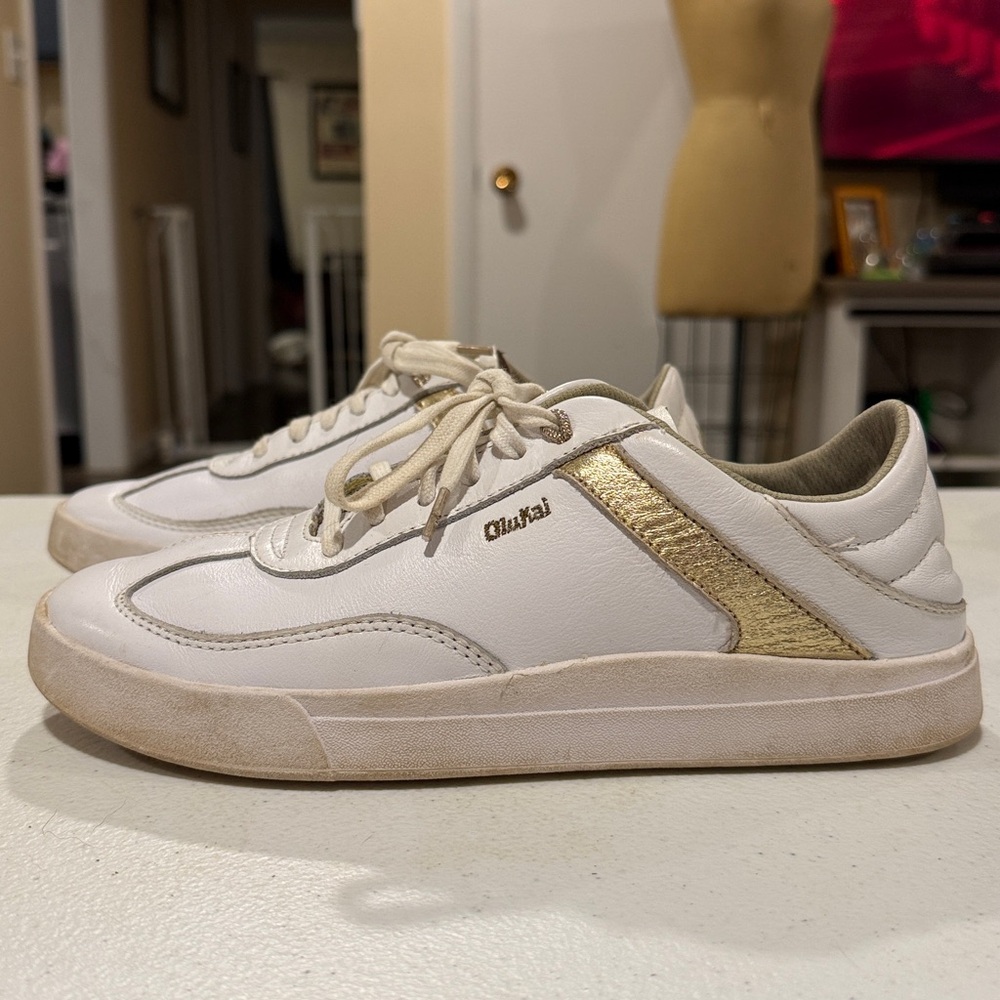 Olukai White Sneaker with Gold Accent Strip